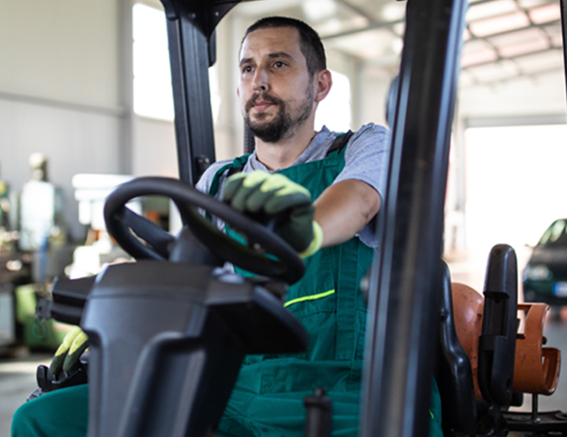 Man driving a forklift.